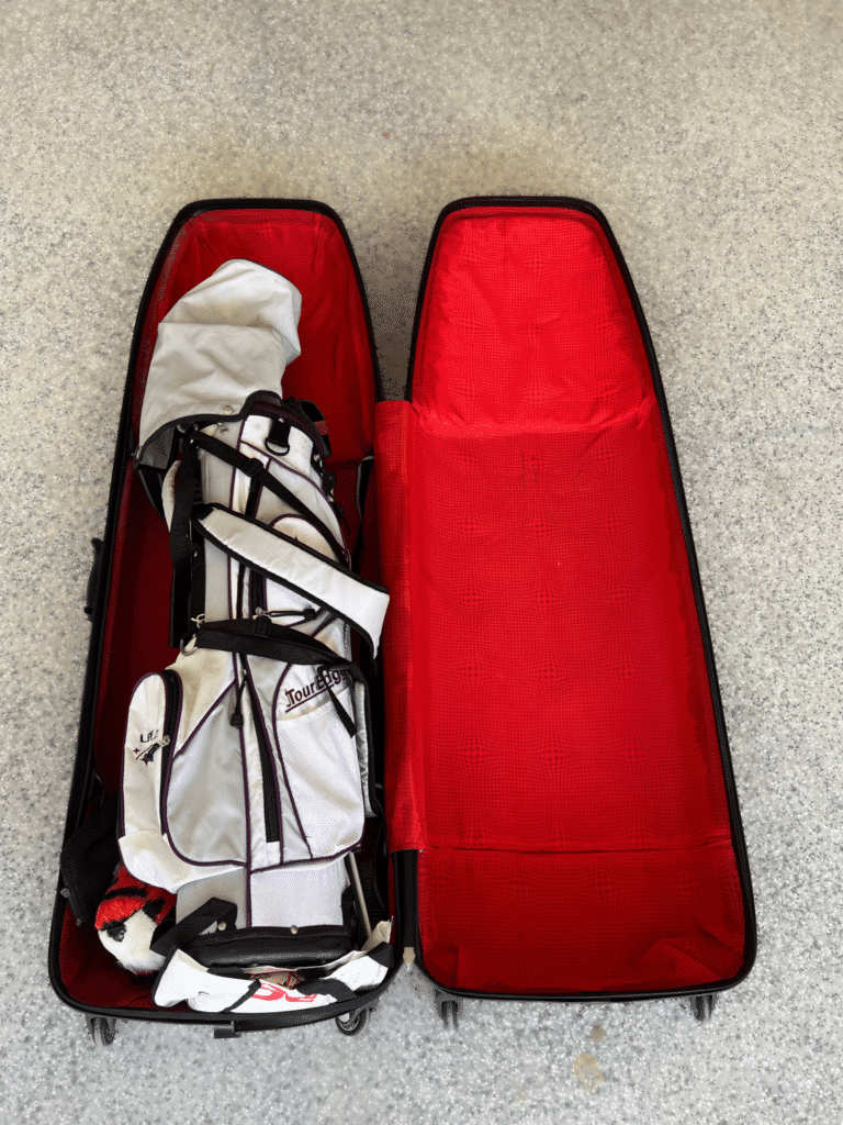 Samsonite hard sided golf travel bags for your next golf trip - Michael's favorite travel golf bags. Image shows a close up of woman holding the straps that keep your golf clubs in place.